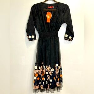 NWT very comfortable and elegant lightweight dress. In sheer fabric.